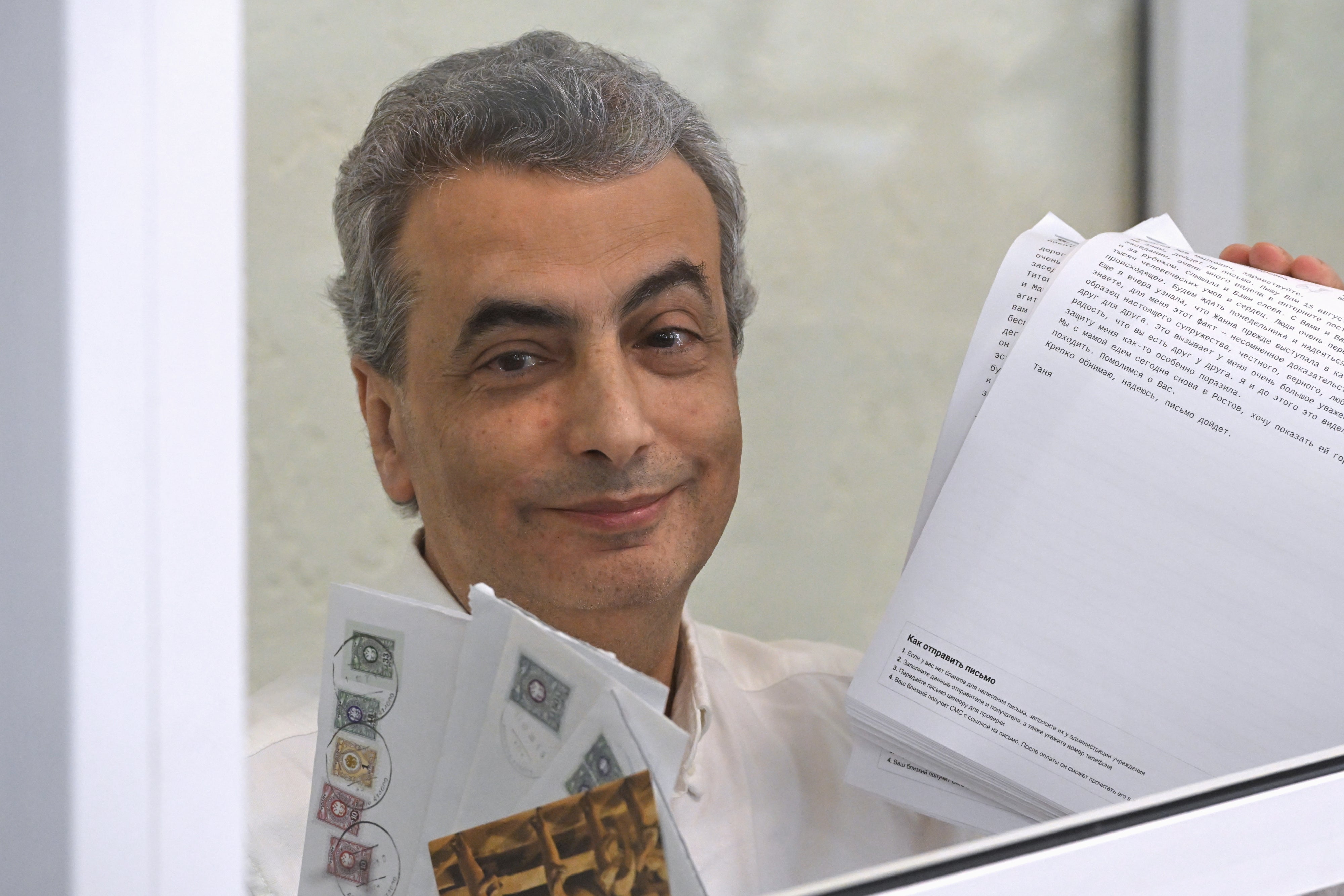 Lev Shlosberg, deputy leader of the Yabloko party, stands in the defendant's box