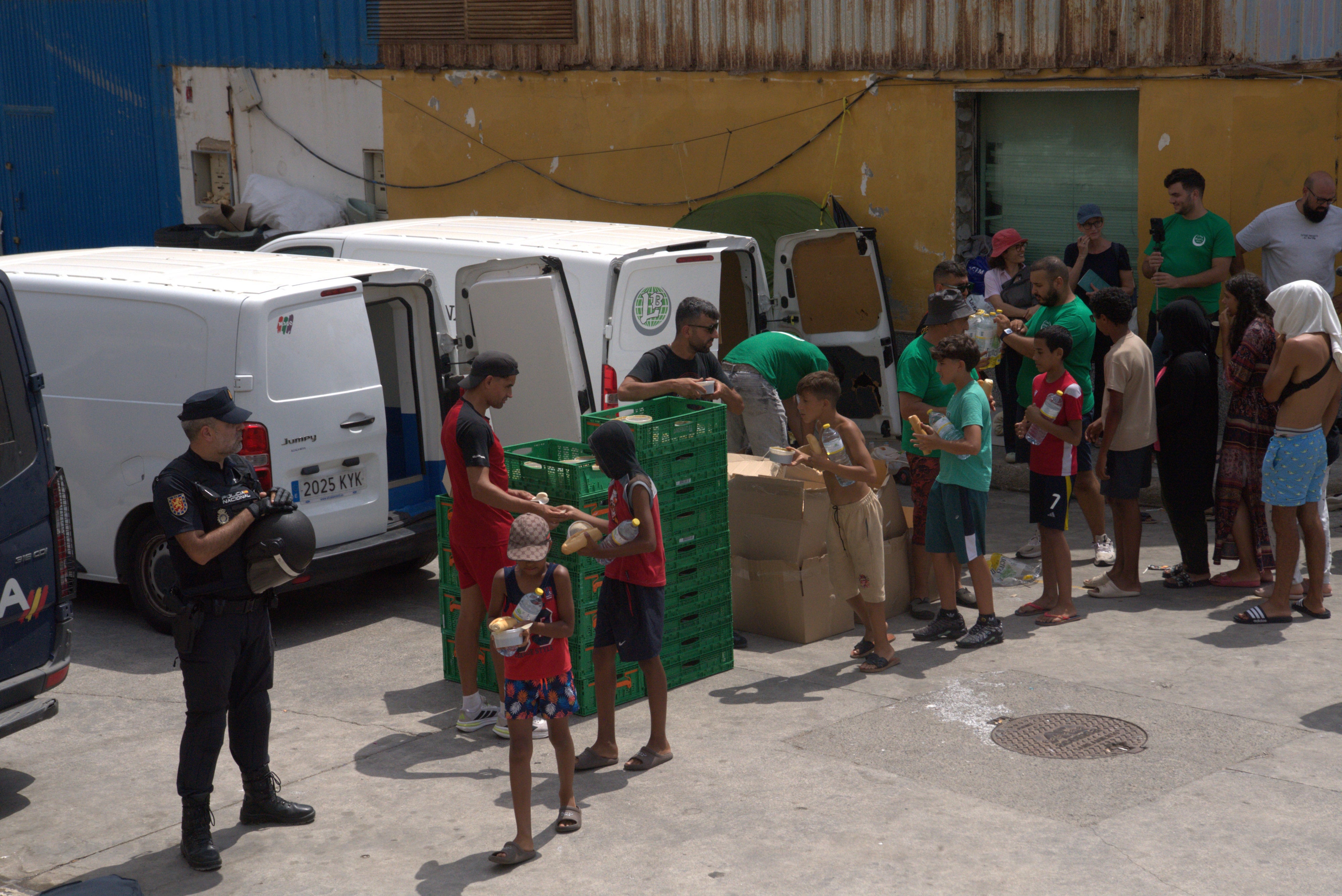 Food distribution by Luna Blanca, a Ceuta nongovernmental organization, at the warehouse district in Ceuta