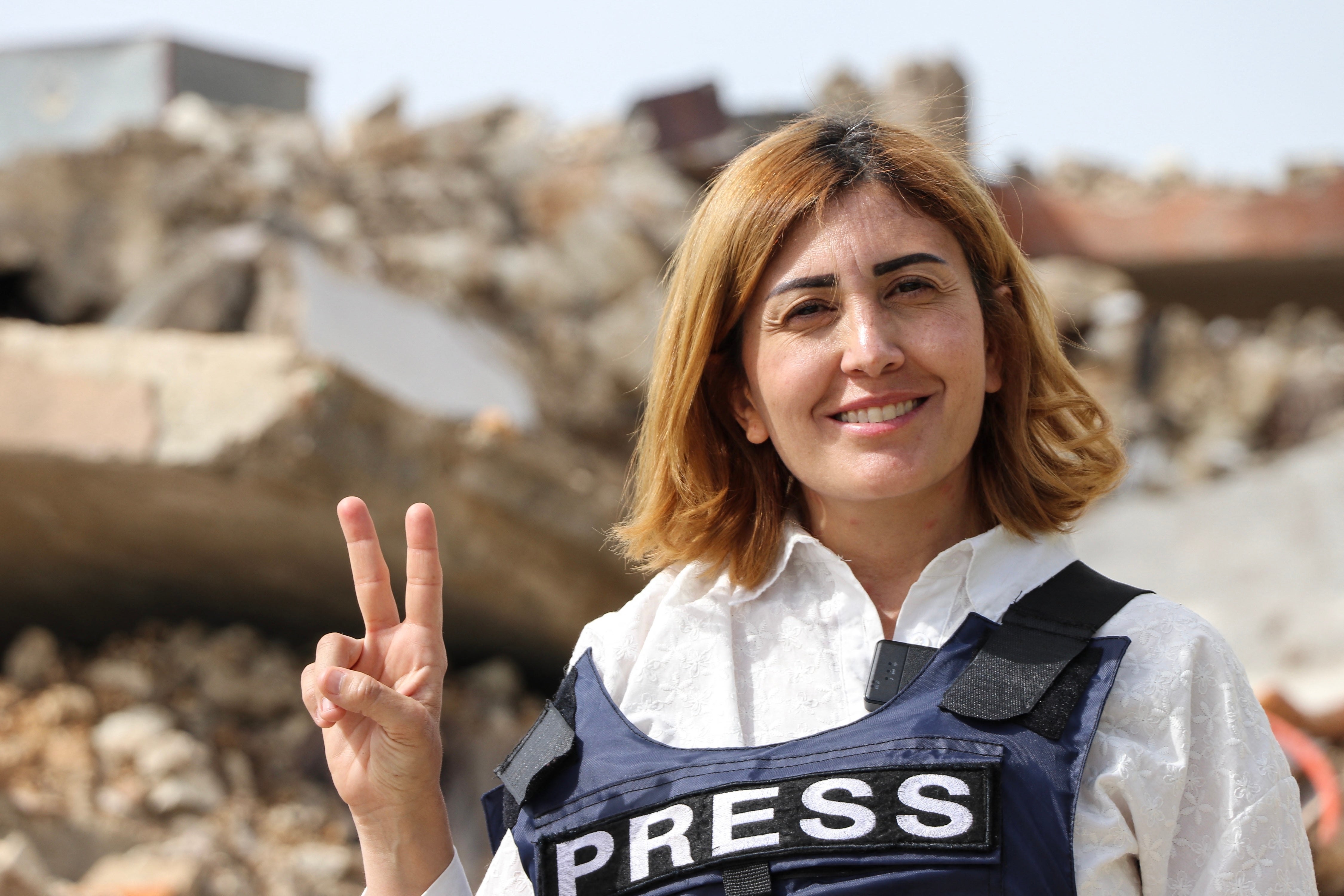 Amal Khalil, a veteran correspondent for the daily newspaper Al-Akhbar, in the southern Lebanese border village of Jebbayn in 2024