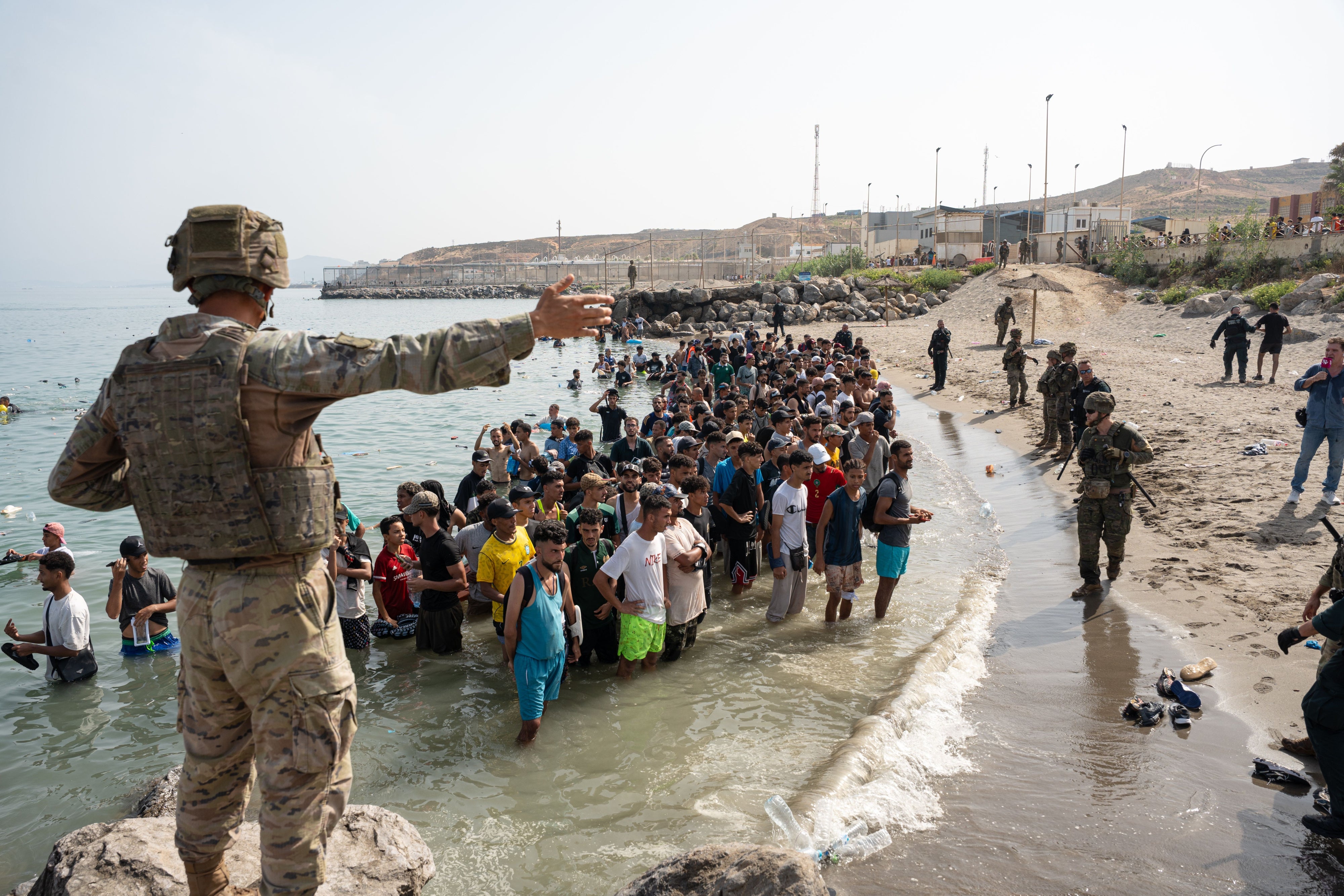 Migrants and asylum seekers gather near the border crossing between Morocco and Ceuta, a Spanish enclave, on July 31, 2026.
