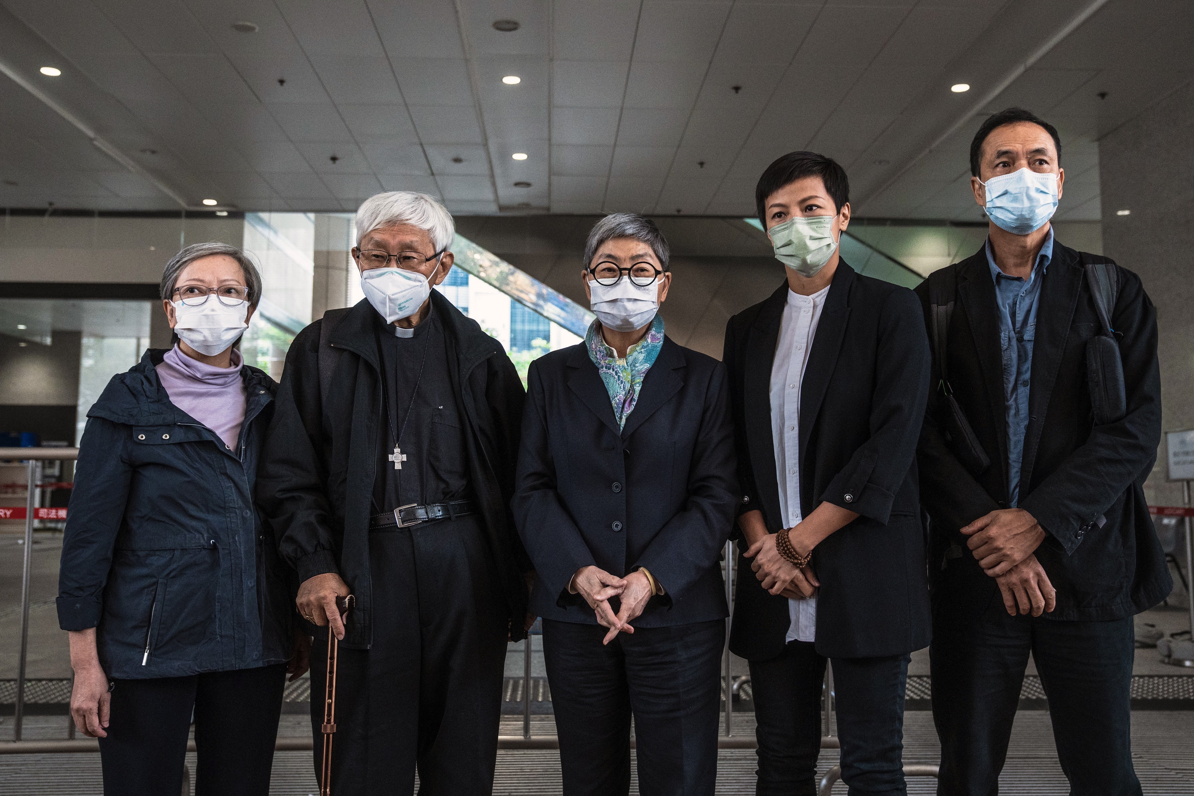 Former trustees of the 612 Humanitarian Relief Fund, following a verdict at the West Kowloon Magistrates' Courts in Hong Kong, November 25, 2022.