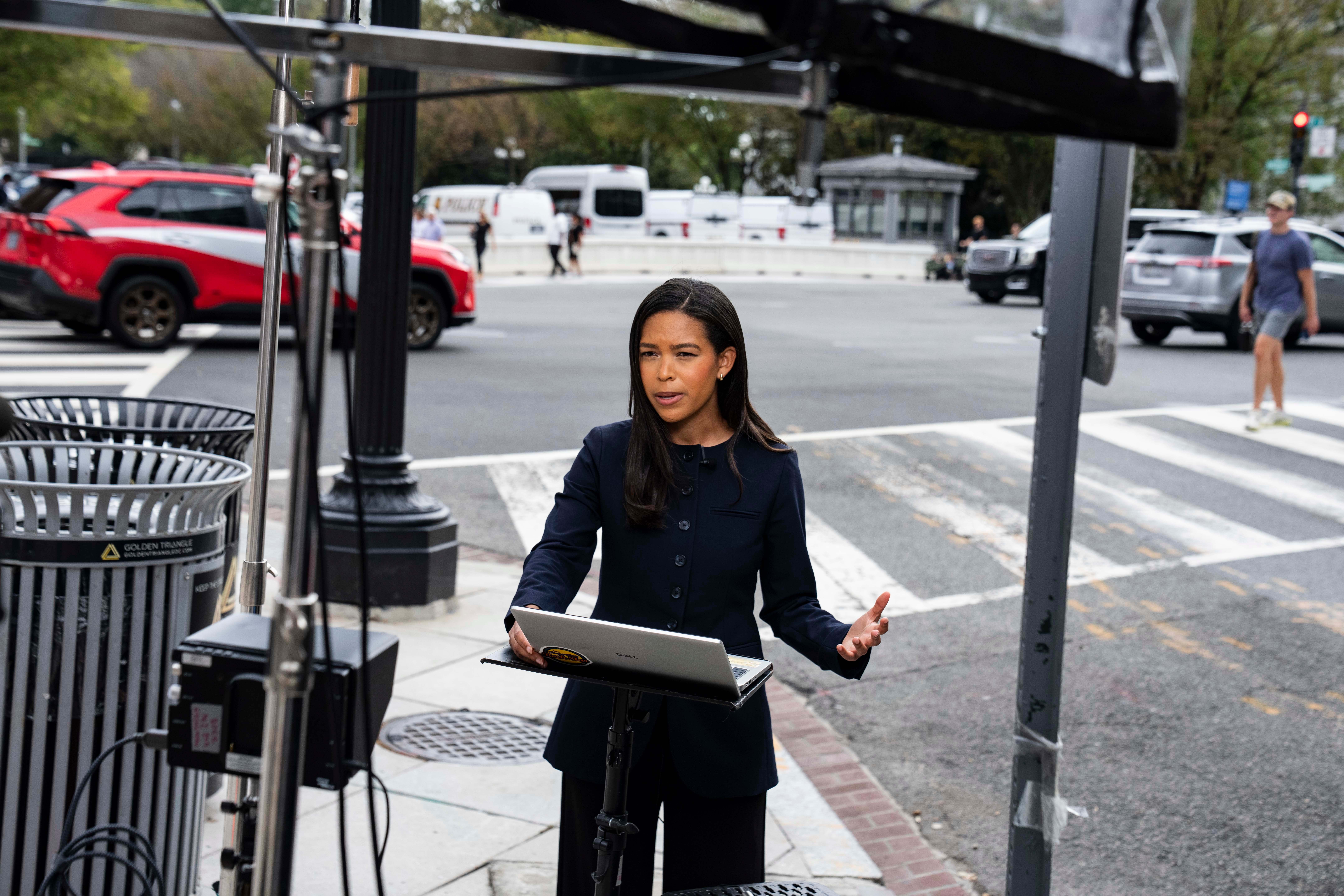 MS NOW White House Correspondent Akayla Gardner prepares for a television report on a street corner outside the White House grounds in Washington, DC, on September 21, 2026.