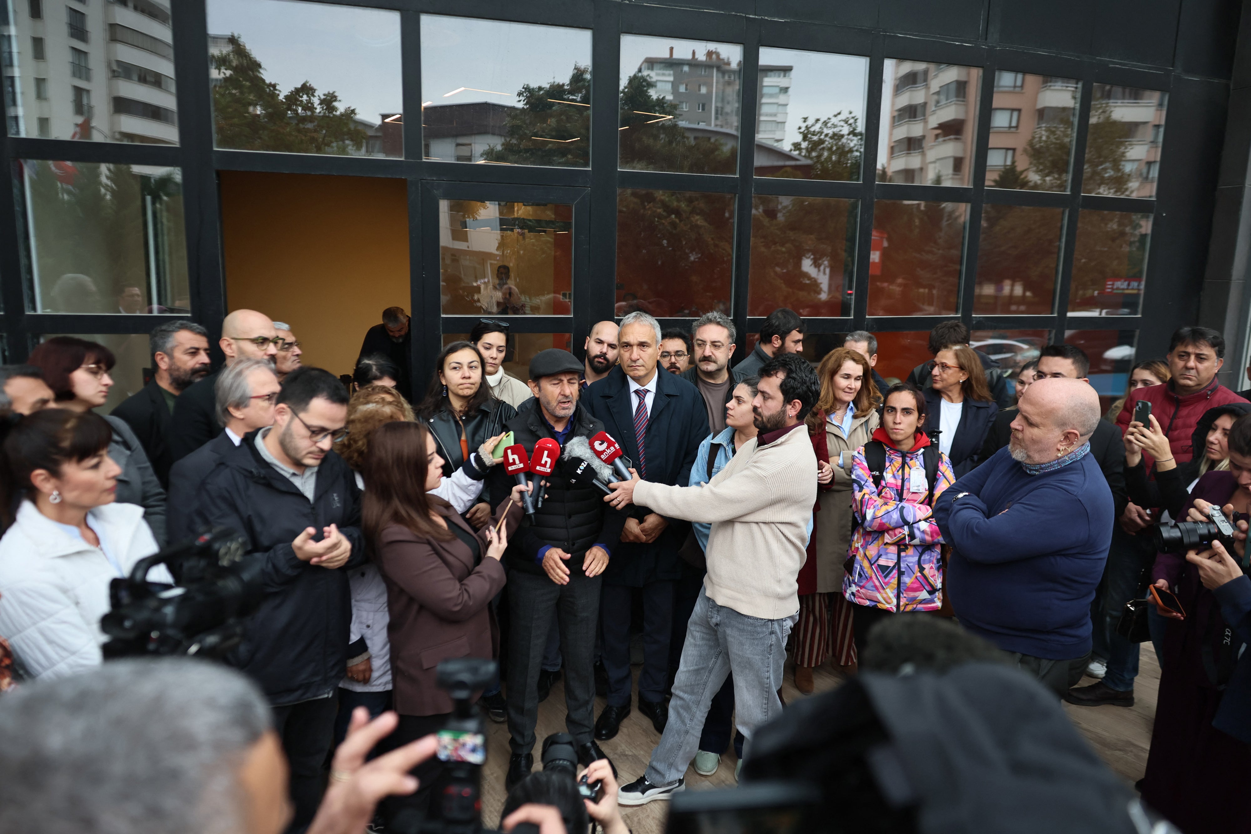 Halk TV general news coordinator Serhan Asker gives an interview to media after the government takeover of the channel, a police raid on the premises, and the announcement of an arrest warrant against its owner and 16 others. Halk TV, Istanbul, October 14, 2026.