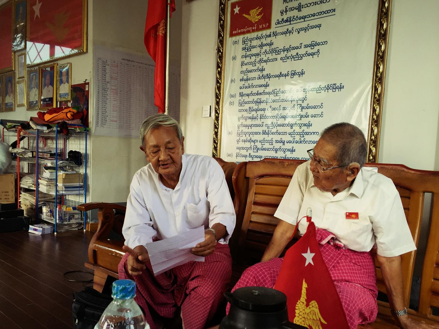 Naing Ngwe Theim and Naing Ngwe Thein, the chair and vice-chair of the Mon National Party, read the party political policies. 