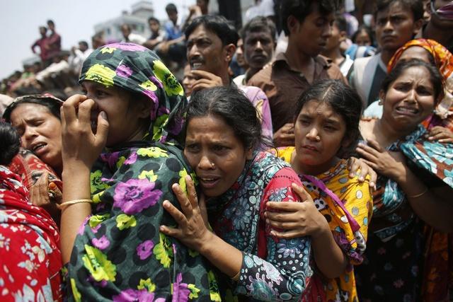 Relatives cry for loved ones trapped in the collapsed Rana Plaza building outside Dhaka on April 24, 2013.