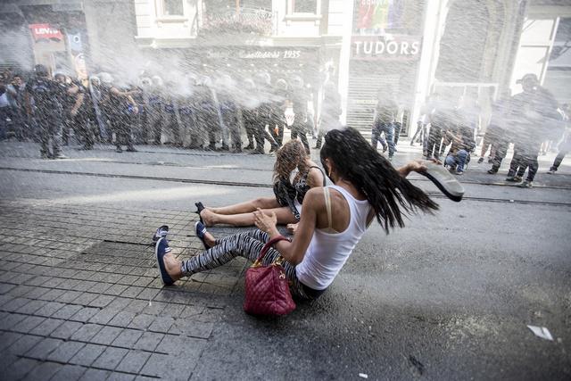 Riot police use a water cannon to disperse LGBT rights activist before a Gay Pride Parade in Istanbul, Turkey, on June 28, 2015.