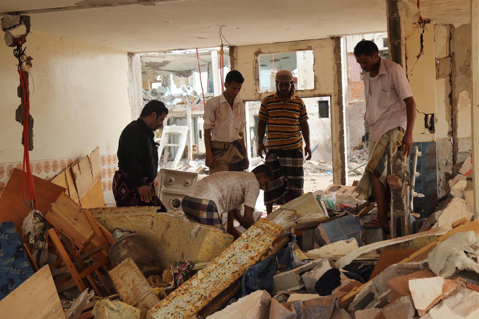 Men dig through rubble in a residential compound housing employees of the Mokha Steam Power Plant and their families following an airstrike by the Saudi-led coalition that killed at least 57 civilians in Mokha, Yemen on July 24, 2015. 