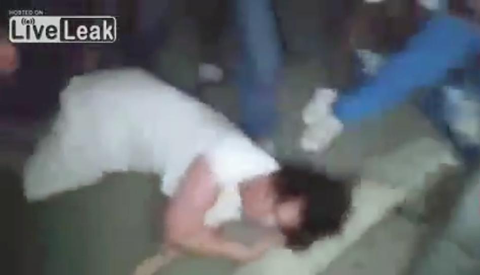 A still from video of a man being beaten during a mob attack after a taxi driver ejected the man from his vehicle and called him a "khanit," local pejorative slang for a homosexual or effeminate man.