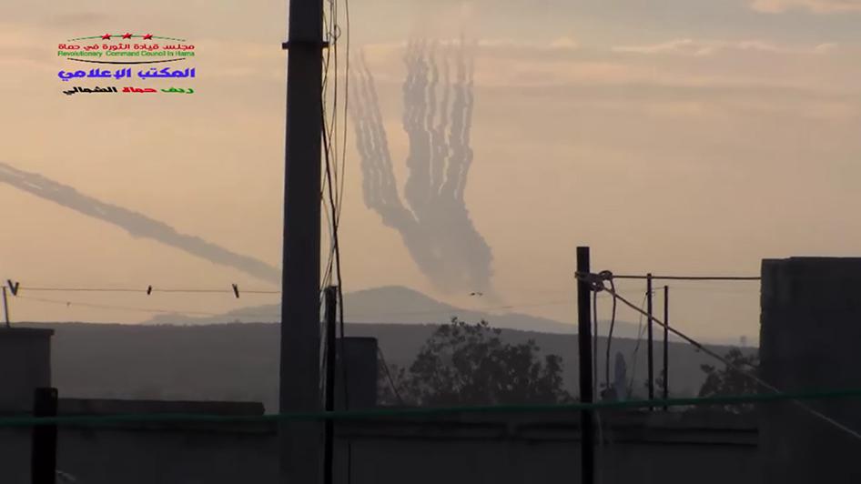 Cluster munition rockets being fired from Syrian Army positions at the base of Zeyn al Abedeen mountain on October 7, 2015. 