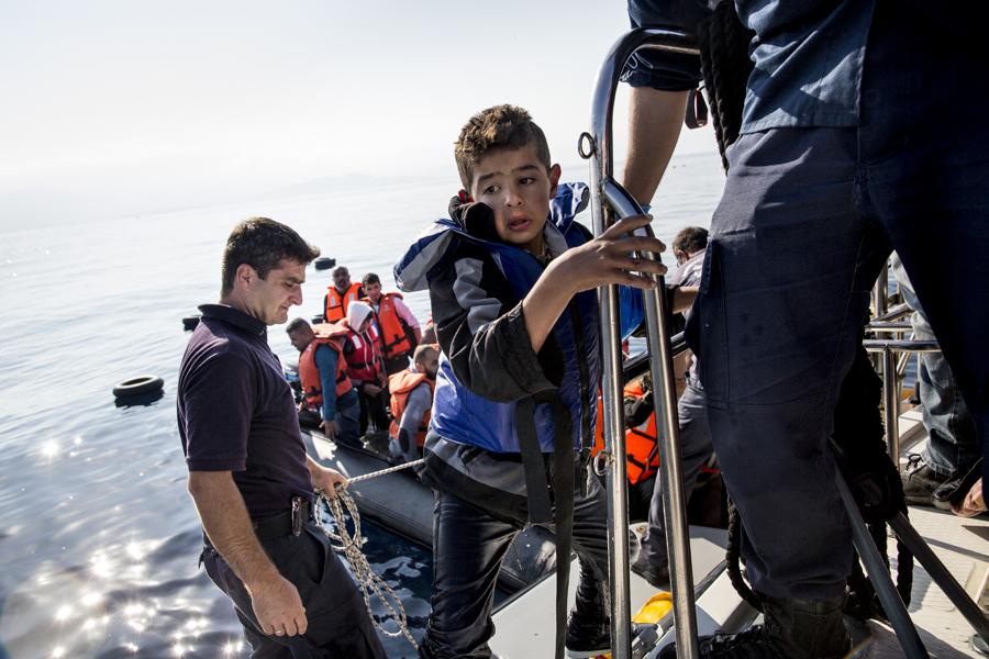 Mostly Syrian asylum seekers and migrants are rescued off a drifting rubber dinghy found by a Hellenic Coast Guard vessel on a rescue mission near the island of Lesbos in Greece.  October 4, 2015.