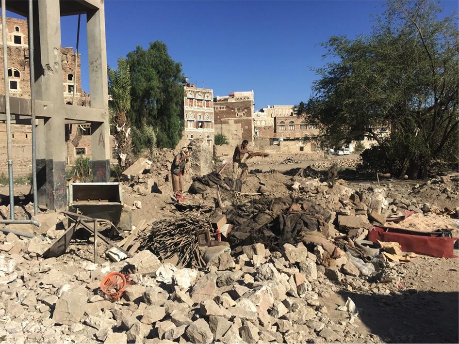 Men clearing rubble left from an airstrike that killed 13 civilians in the Sanaa’s Old City, a UNESCO World Heritage site, on September 18, 2015. 