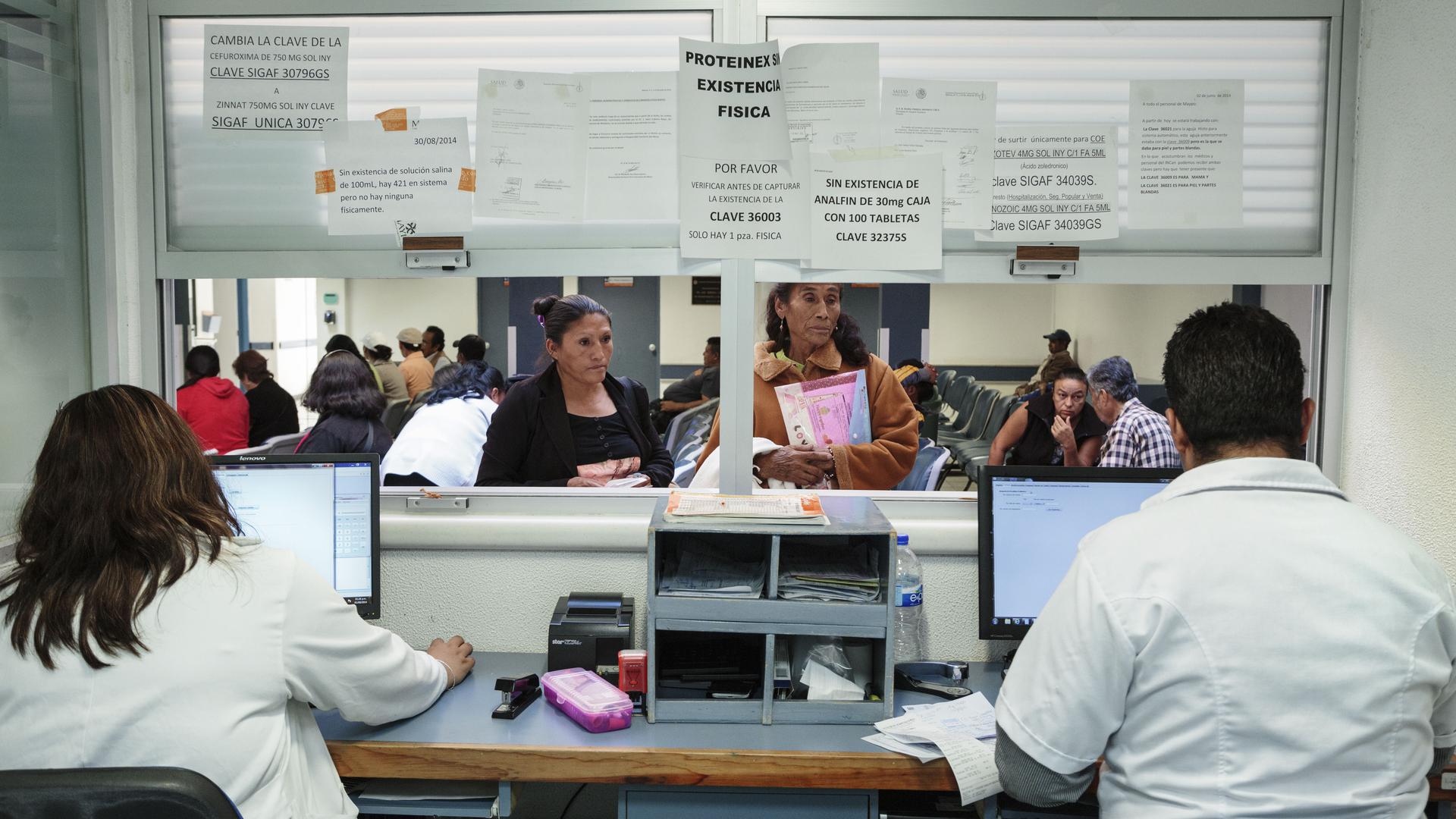 Doña Remedios and her daughter at the pharmacy of the National Cancer Institute in Mexico City, Mexico on September 1, 2014 to fill a prescription for morphine. They have to travel for several hours to procure the medication because there are no hospitals