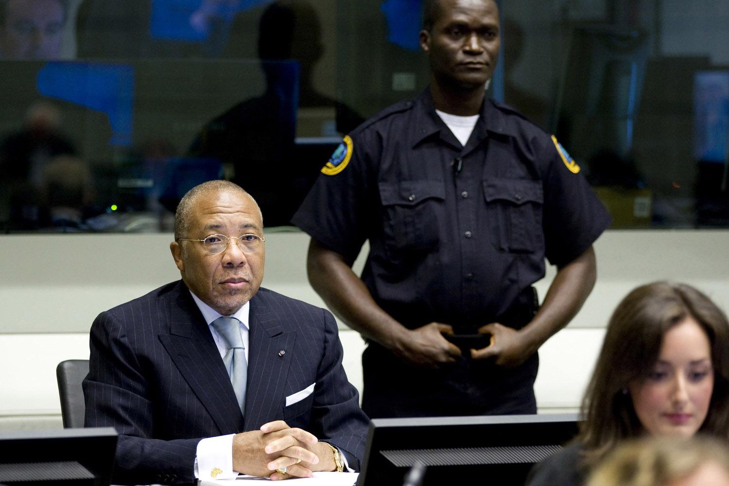 Charles Taylor sits at the defendant's table during his trial at the Special Court for Sierra Leone in The Hague, August 5, 2010.
