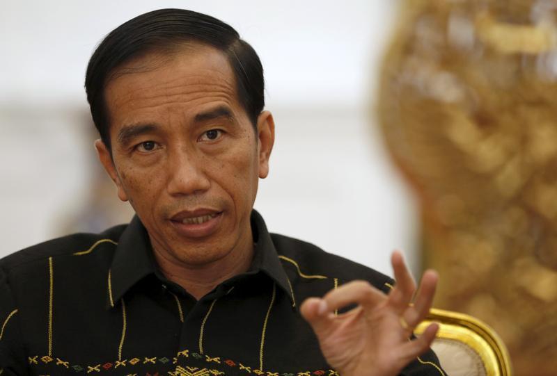 Indonesian President Joko Widodo gestures during an interview with Reuters at the presidential palace in Jakarta, Indonesia February 10, 2016.