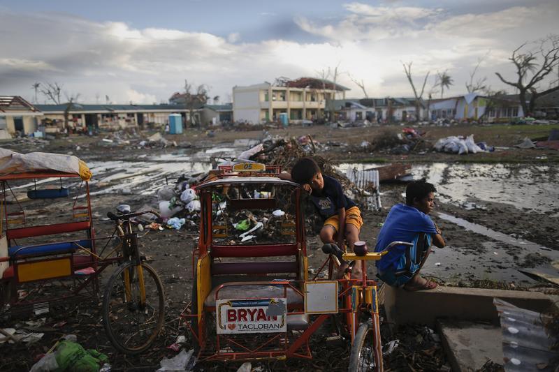 Survivors of Typhoon Haiyan pass the time at a school where hundreds have found shelter at, in Tacloban, Philippines, November 21, 2013.