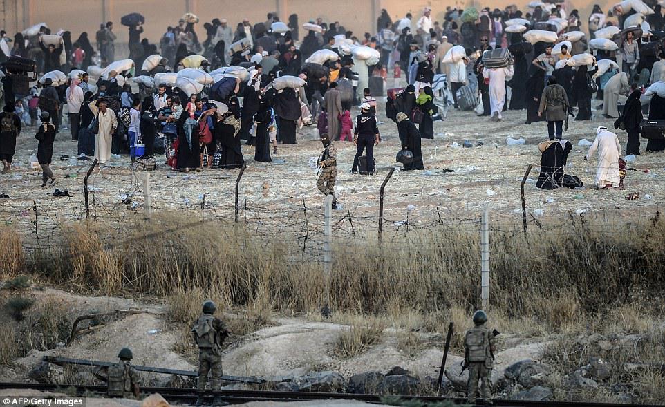 At Tal Abyad –Akçakale border crossing, in June 2015, Turkish border guards manning Turkey’s closed border watched ISIS fighters order displaced Syrian civilians back from the border.