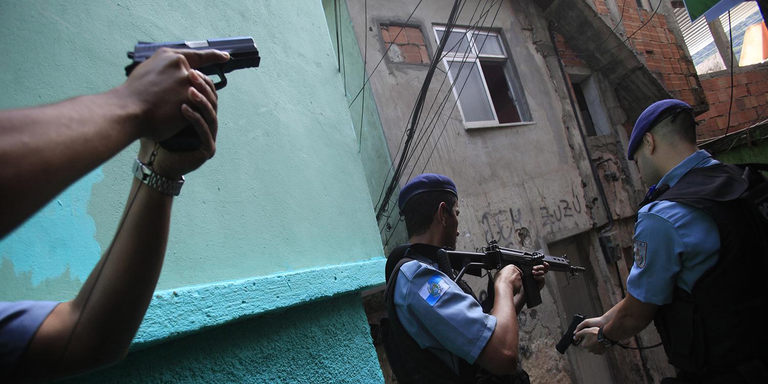 Policemen patrol the Rocinha favela in Rio de Janeiro on September 14, 2012. 