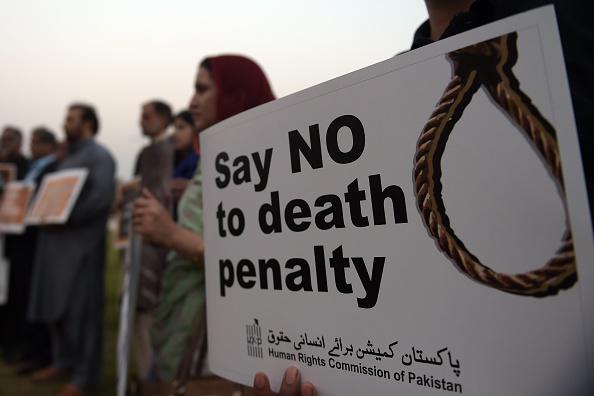 Activists from the Human Rights Commission of Pakistan (HRCP) carry placards during a demonstration in Islamabad, Pakistan on October 10, 2015.