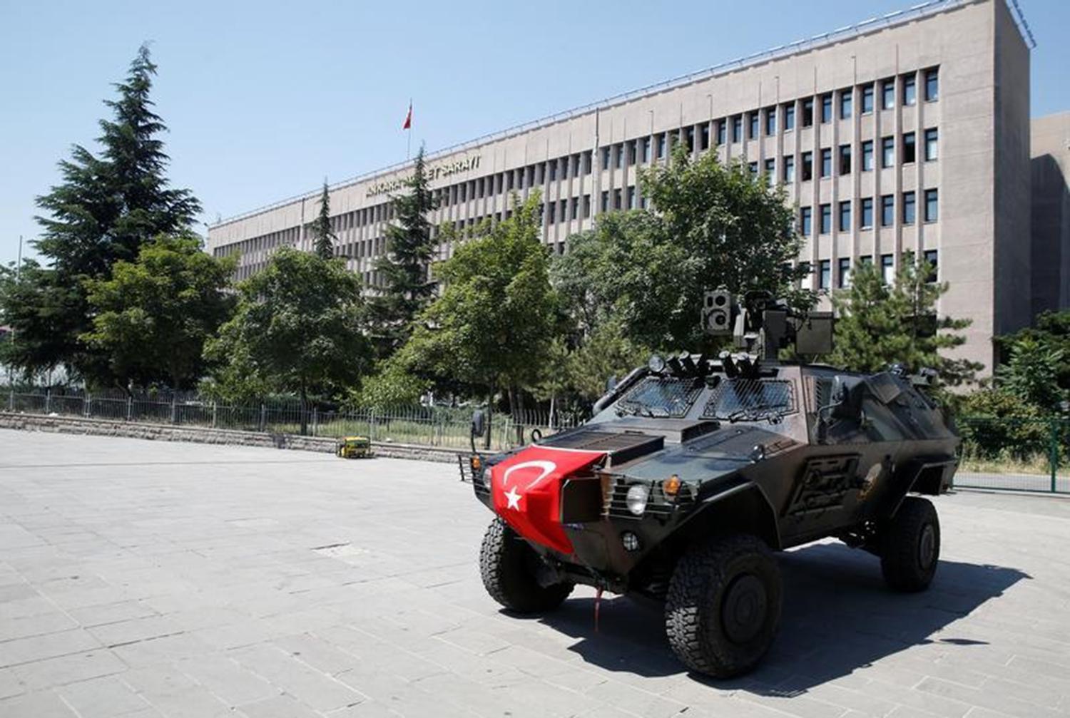Members of police special forces keep watch from an armored vehicle in front of the Justice Palace in Ankara, Turkey, July 18, 2016. © 2016 Baz Ratner/Reuters