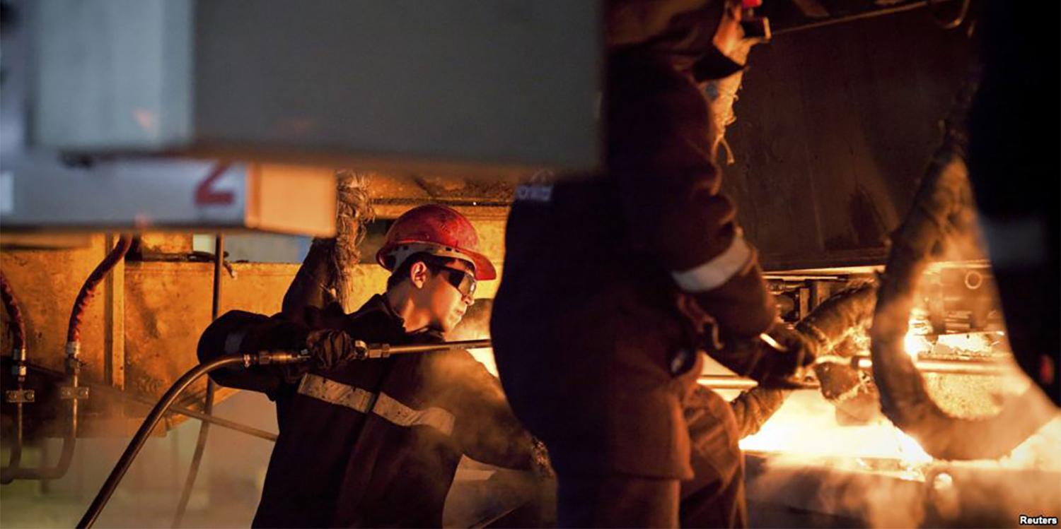 Workers at the ArcelorMittal steel plant in Temirtau, June 13, 2012.