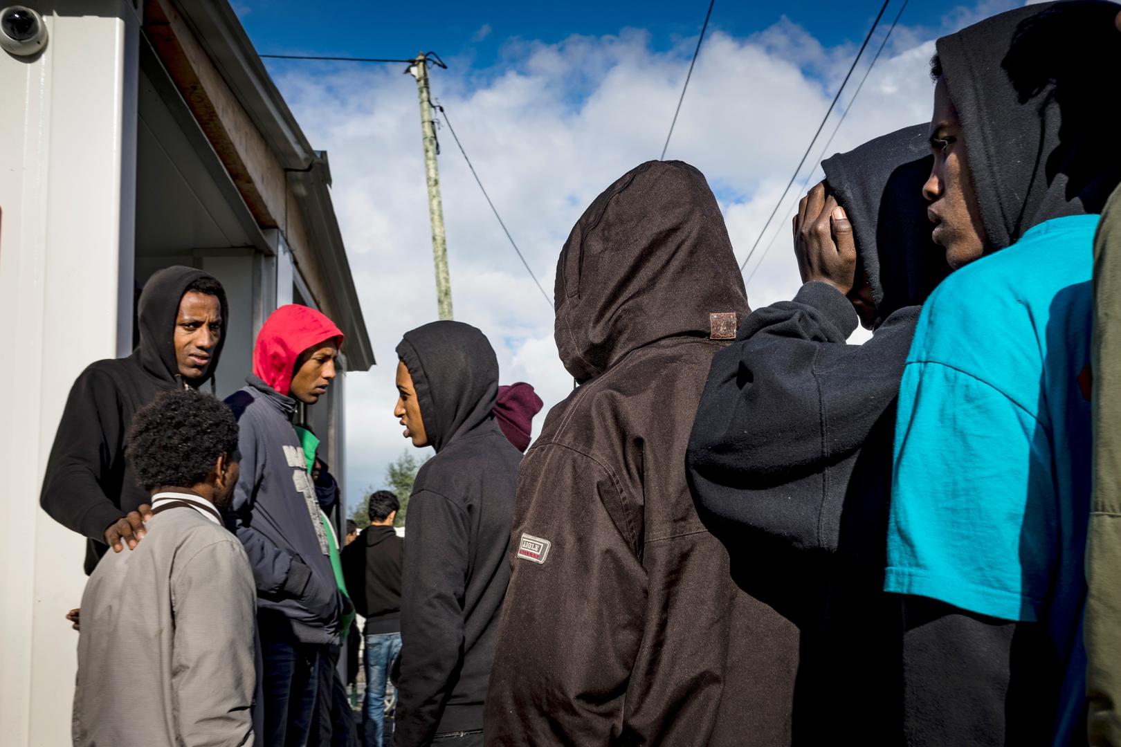 Unaccompanied children in the Calais migrant camp await interviews with the UK Home Office, October 22, 2016. 