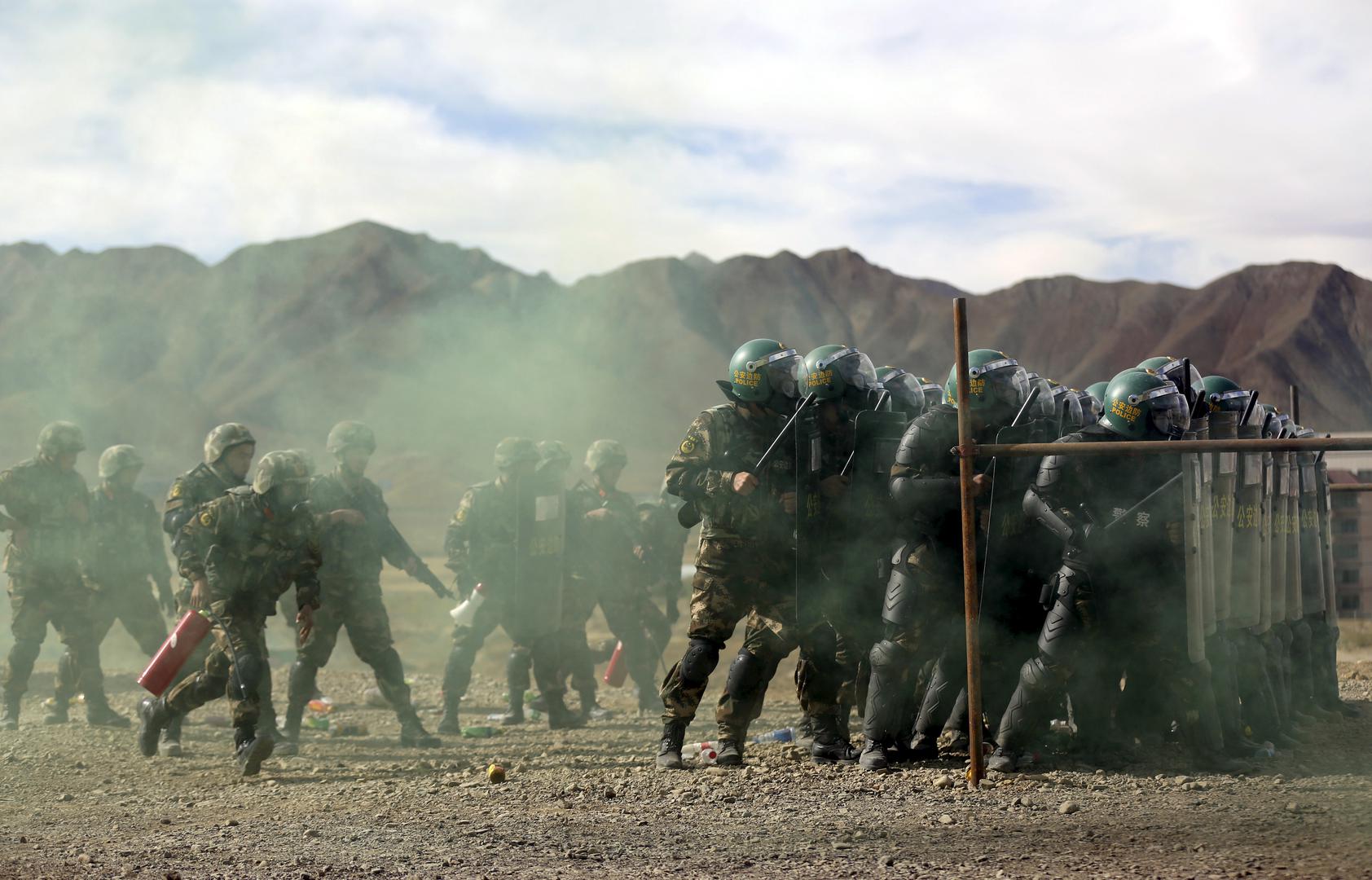 A unit from the Chinese People's Armed Police Force participates in a drill with riot gear at a military base in Shigatse, Tibet Autonomous Region, China on October 24, 2015.