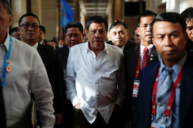 President Rodrigo Duterte walks between meetings at the ASEAN Summit in Vientiane, Laos on September 6, 2016. 