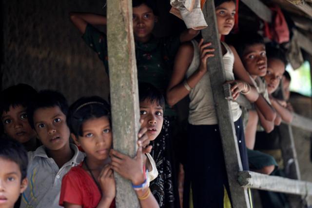 Rohingya Muslim children stand in U Shey Kya village outside Maungdaw in Rakhine state.