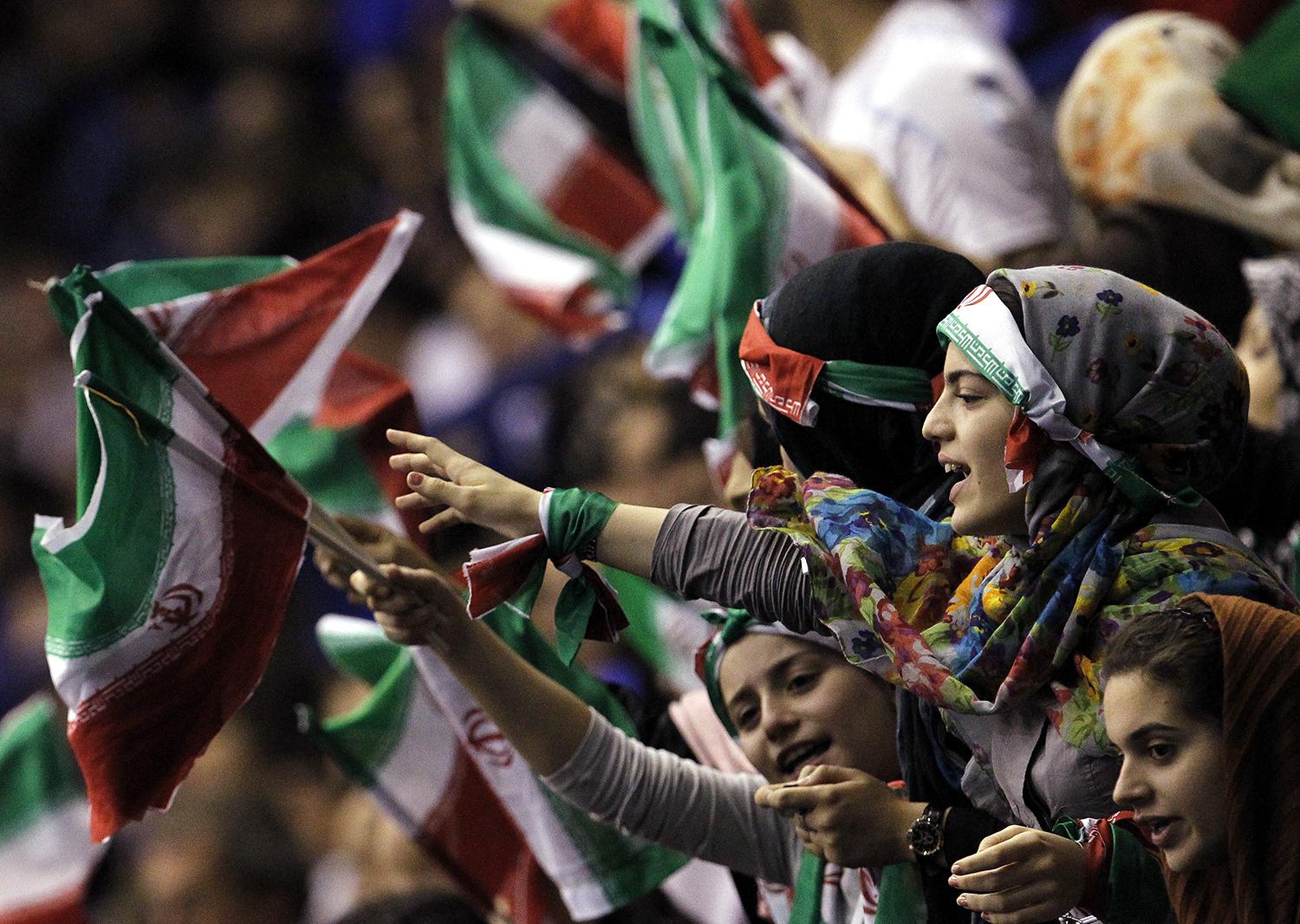 Iran's supporters shout during the FIVB Men's Volleyball World Championship first round match between Iran and Italy in Milan September 27, 2010.  © 2010 Reuters