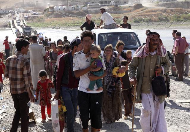 Yezidis at the Iraqi-Syrian border crossing in Fishkhabour, Dohuk province, August 10, 2014.