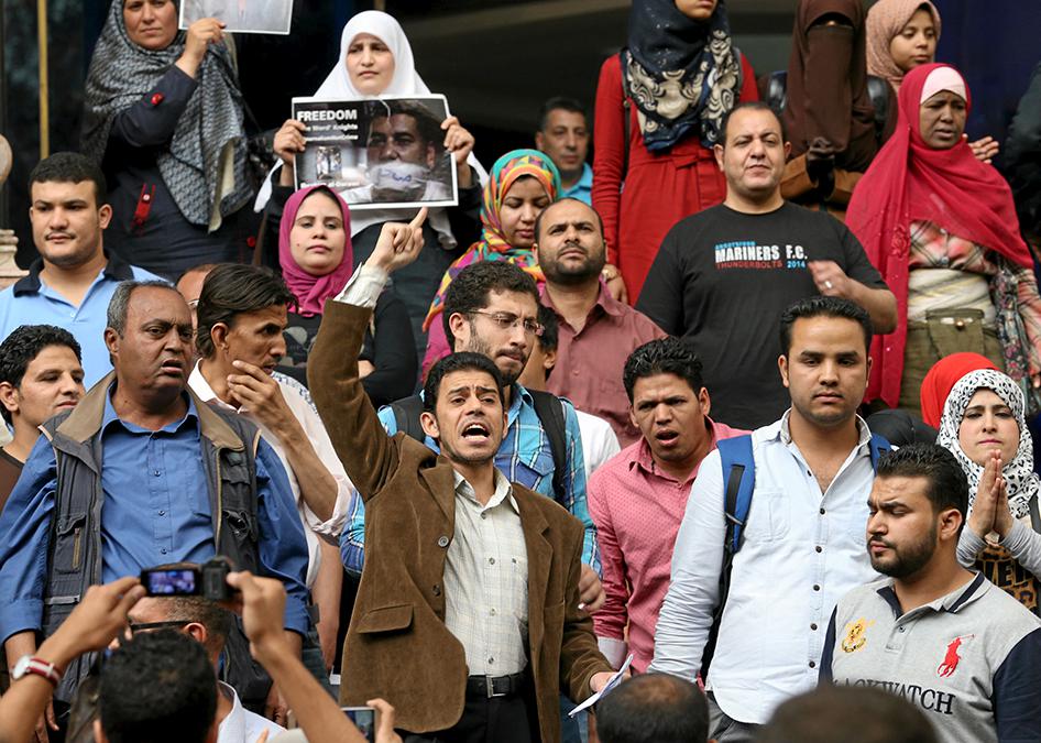 Journalists and activists protest against the restriction of press freedom and to demand the release of detained journalists, in front of the Press Syndicate in Cairo, Egypt on April 26, 2016.