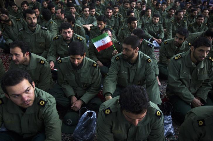 Members of the revolutionary guard attend the anniversary ceremony of Iran's Islamic Revolution at the Khomeini shrine south of Tehran on February 1, 2012.
