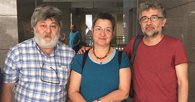Ahmet Nesin, Şebnem Korur Fincancı and Erol Önderoğlu at the court house in Istanbul hours before being jailed pending investigation into spurious allegations of “making terrorist propaganda.”