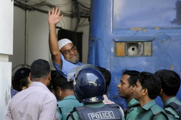 Mir Quasem Ali boards a prison van after International Crimes Tribunal sentenced him to death on November 2, 2014, for alleged 1971 war crimes. 