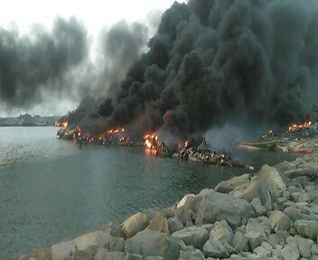 Fishing boats burn in al-Hayma Port in Hodaida governorate after the December 12 attack in which CBU-105 Sensor Fuzed Weapons were used.