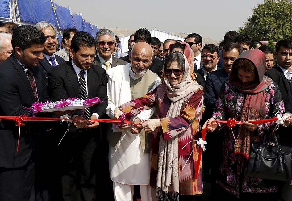 Afghan President Ashraf Ghani cuts a ribbon 