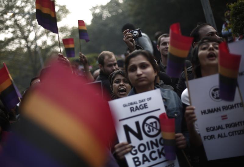 Gay rights activists hold placards as they shout slogans during a protest against a verdict by the Supreme Court in New Delhi December 15, 2013. 