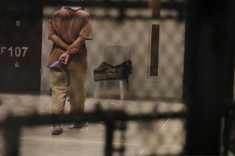 A detainee paces around a cell block while being held in Joint Task Force Guantanamo's Camp VI at the U.S. Naval Base in Guantanamo Bay, Cuba March 22, 2016.