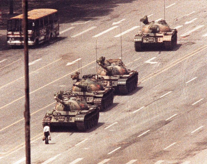 A man stands in front of a convoy of tanks in the Avenue of Eternal Peace in Tiananmen Square in Beijing in this June 5, 1989 file photo.