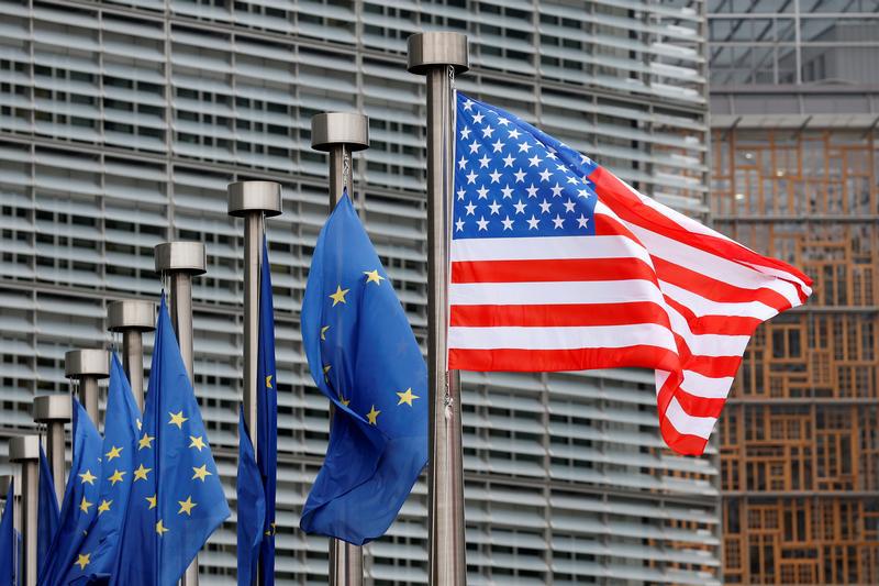 U.S. and European Union flags are pictured in front of the European Commission headquarters in Brussels, Belgium February 20, 2017.