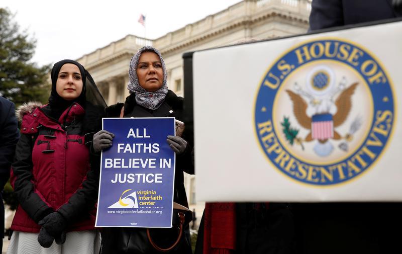 Muslim women listen to remarks during a news conference held by House Democrats to introduce legislation "to ensure that no one is denied entry into the United States because of their religion" at the U.S. Capitol in Washington February 2, 2017. 