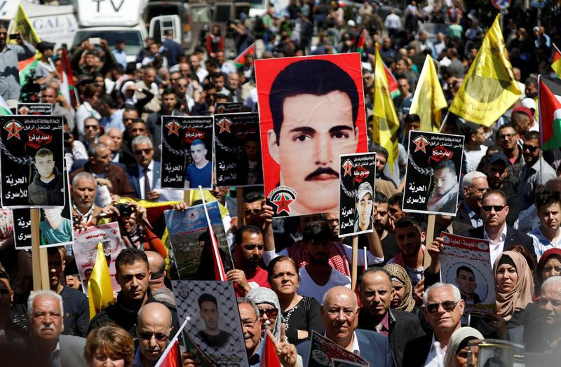 Demonstrators gather during a rally in support of Palestinian prisoners on hunger strike in Israeli jails, in the West Bank city of Ramallah April 17, 2017.