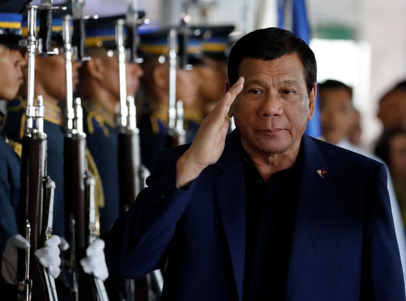 President Rodrigo Duterte salutes the honor guards at the Ninoy Aquino International Airport in Metro Manila, Philippines, May 24, 2017.