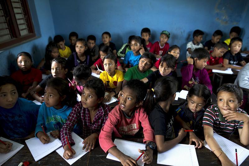 Nepalese children in a class provided by an international aid organization inside a primary school in Sankhu, on the outskirts of Kathmandu