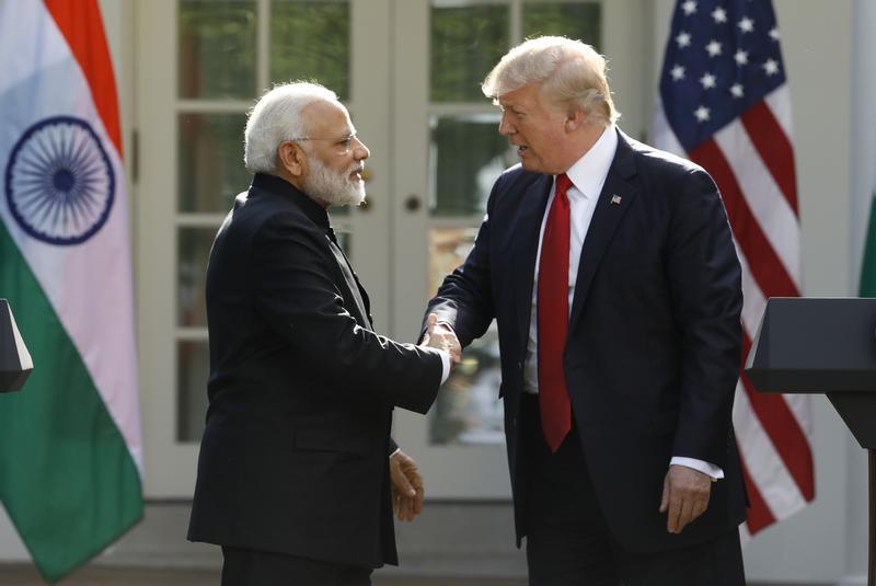 U.S. President Donald Trump (R) greets Indian Prime Minister Narendra Modi during their joint news conference in the Rose Garden of the White House in Washington, U.S., June 26, 2017.