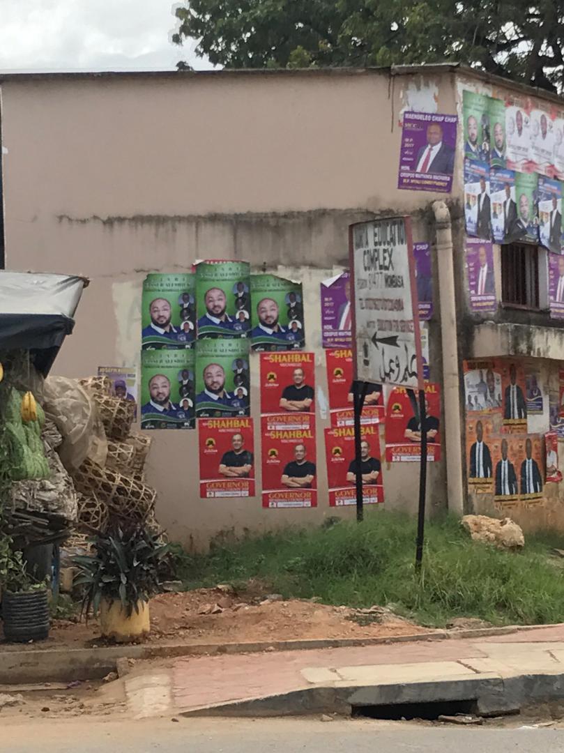 Posters of candidates running for political offices in the upcoming Kenya elections displayed on a building in Mombasa town 