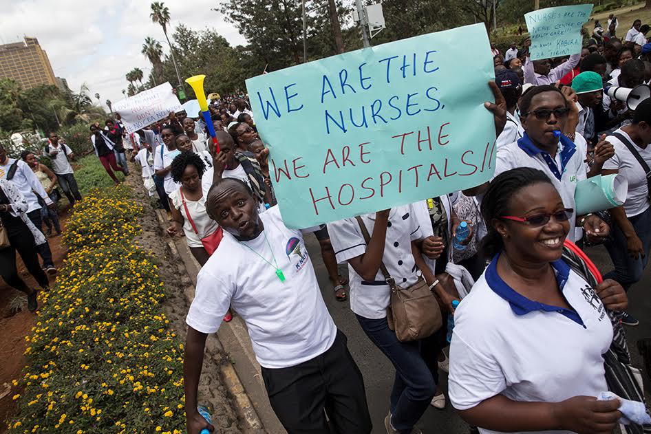 Kenyan nurses march holding banners as they take part in a protest in Nairobi, Kenya, June 12, 2017. 
