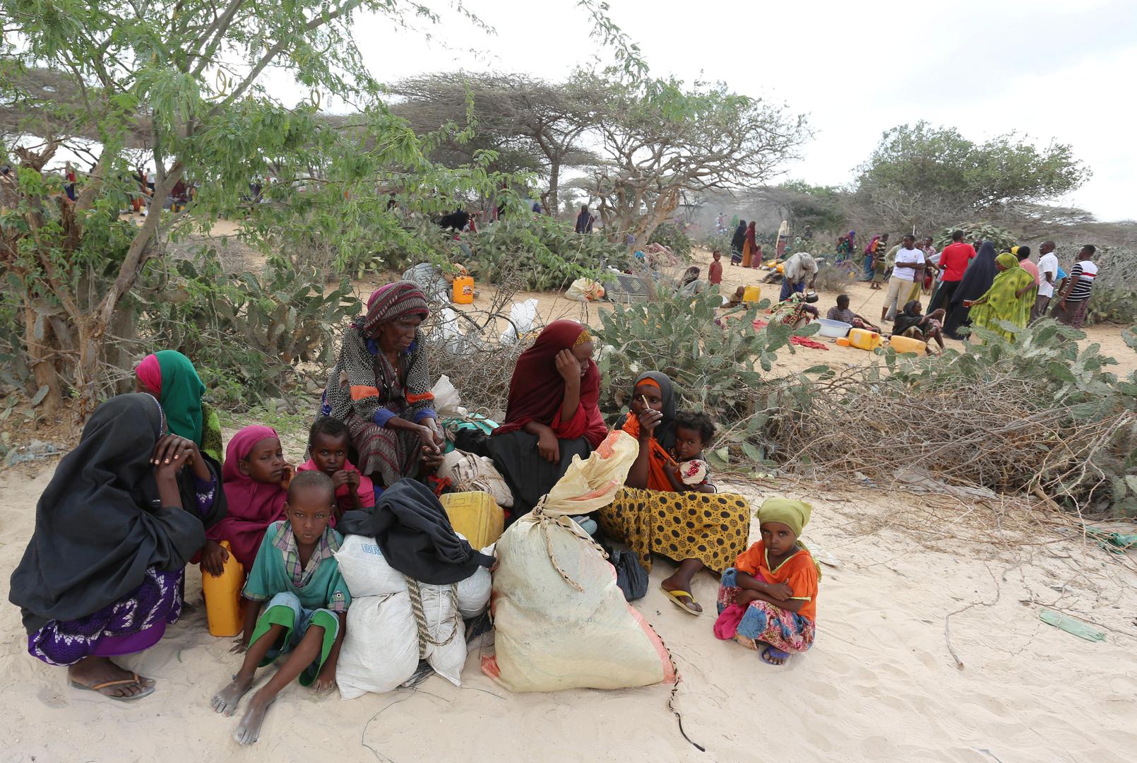 Somali families rest as they flee from drought-stricken Lower Shabelle region before entering makeshift camps in Somalia's capital, Mogadishu, joining the thousands already displaced, March 17, 2017. Al-Shabab forces attacked villages in Lower Shabelle re