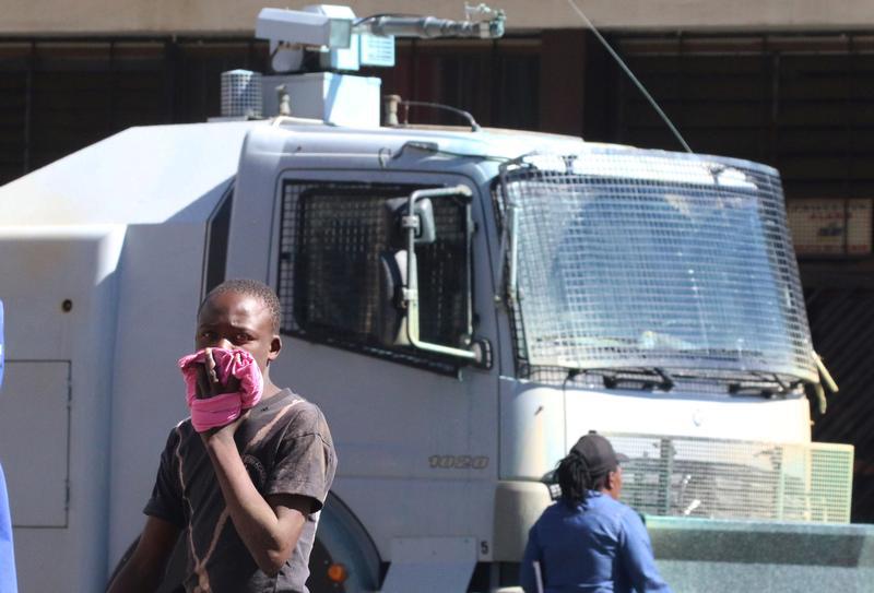 A man reacts to teargas fired by police at protesters calling for electoral reform in Harare, Zimbabwe, July 12, 2017.