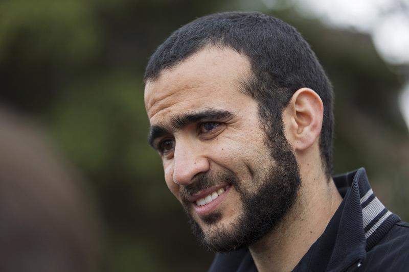 Omar Khadr listens to a question during a news conference after being released on bail in Edmonton, Alberta, May 7, 2015.